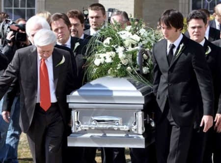 Michael Blosil being carried by his relatives in a casket for his last ritual before laying to rest